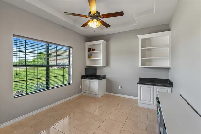 a kitchen that has a sink a stove and a window