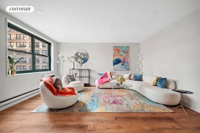 a living room with furniture fireplace and window