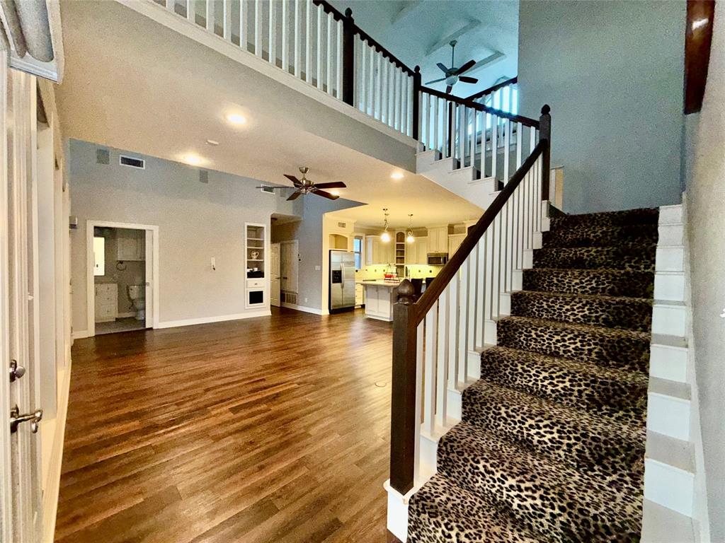 3815 Holly Ridge Drive, Unit GUEST Longview, TX 75605 - Photo 10 of 31 Staircase with wood finished floors, a high ceiling, ceiling fan, and recessed lighting