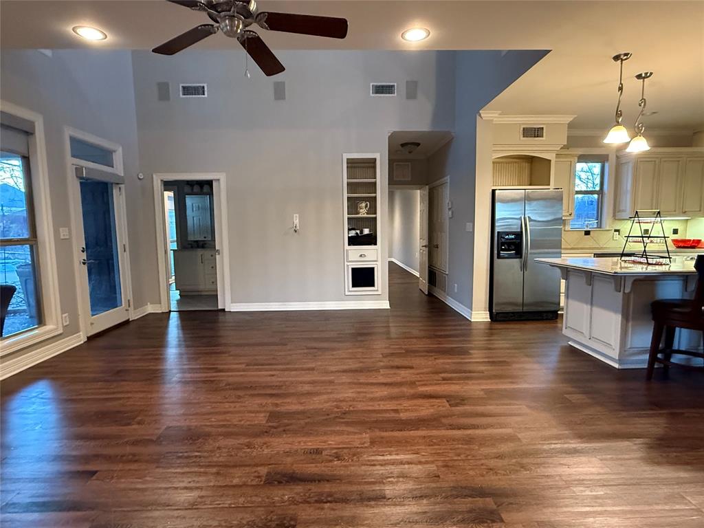 3815 Holly Ridge Drive, Unit GUEST Longview, TX 75605 - Photo 12 of 31 Living room featuring ceiling fan, dark wood-style flooring, recessed lighting, and a high ceiling