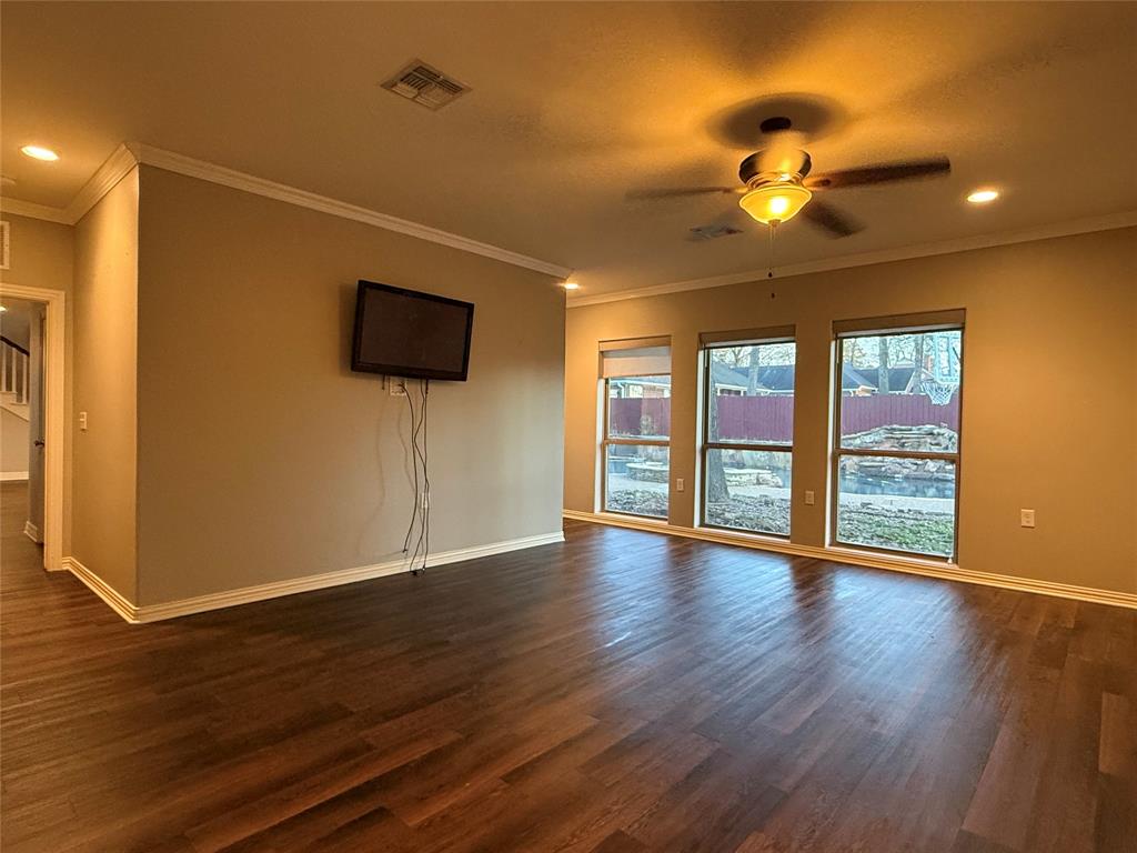 3815 Holly Ridge Drive, Unit GUEST Longview, TX 75605 - Photo 13 of 31 Unfurnished living room with recessed lighting, crown molding, ceiling fan, and dark wood finished floors