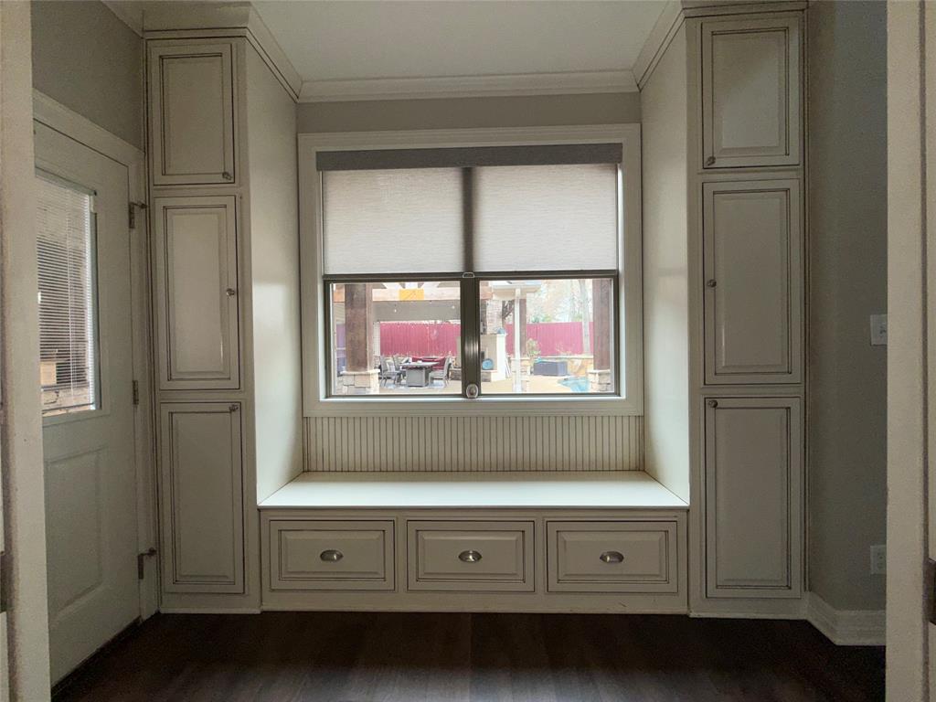 3815 Holly Ridge Drive, Unit GUEST Longview, TX 75605 - Photo 23 of 31 Mudroom with crown molding and dark wood-style floors
