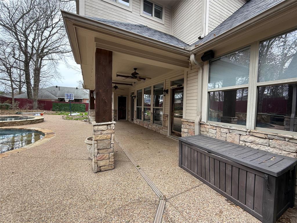 3815 Holly Ridge Drive, Unit GUEST Longview, TX 75605 - Photo 26 of 31 View of patio / terrace with ceiling fan and an in-ground hot tub