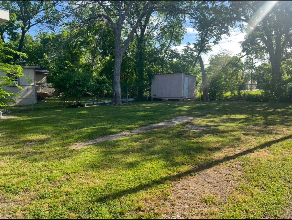 415 Randall Street Pasadena, TX 77506 - Photo 13 of 13 a backyard of a house with lots of green space