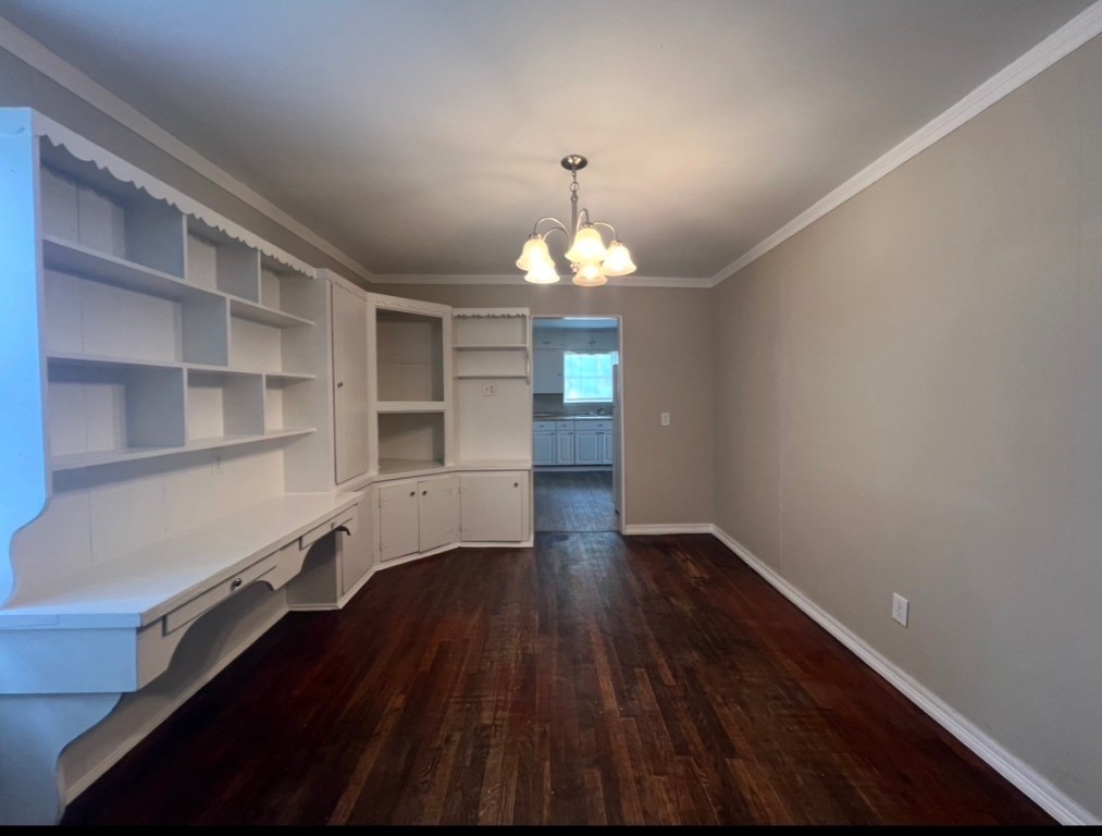 415 Randall Street Pasadena, TX 77506 - Photo 2 of 13 a hallway with a large window and wooden floor
