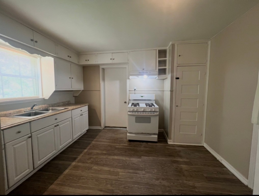 415 Randall Street Pasadena, TX 77506 - Photo 4 of 13 a kitchen with sink cabinets and window