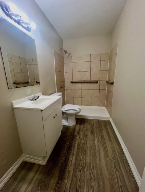 415 Randall Street Pasadena, TX 77506 - Photo 5 of 13 a bathroom with a sink a toilet a mirror and shower