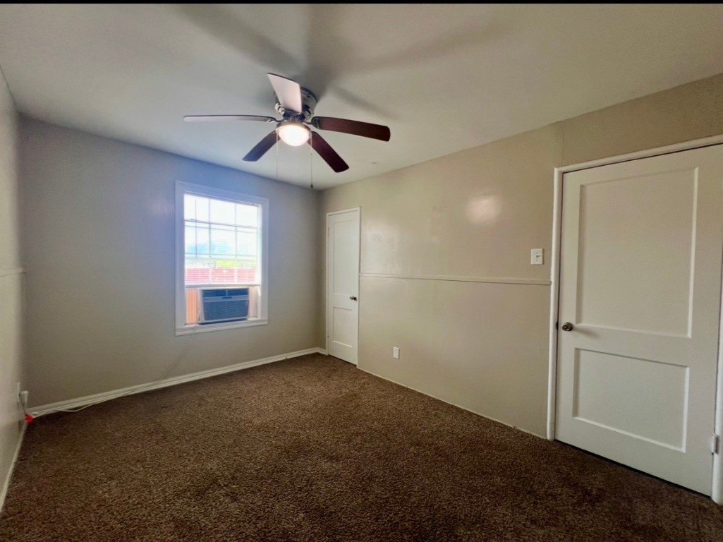 415 Randall Street Pasadena, TX 77506 - Photo 9 of 13 an empty room with windows and fan