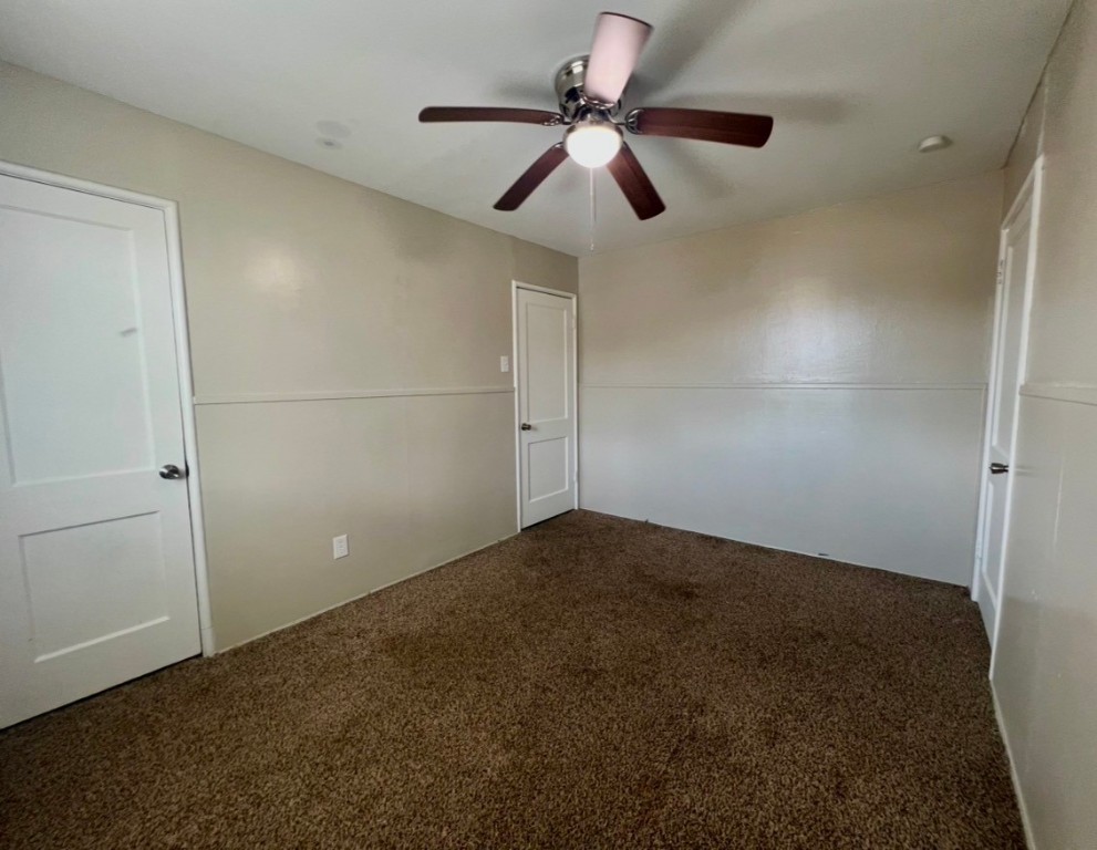 415 Randall Street Pasadena, TX 77506 - Photo 10 of 13 an empty room with closet and fan