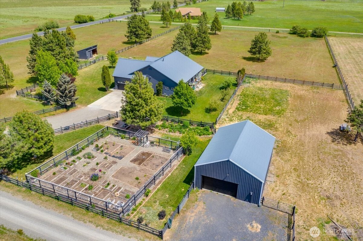 644 Masterson Road Cle Elum, WA 98922 - Photo 4 of 40 an aerial view of a house with a yard and lake view
