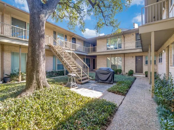 a view of an house with backyard porch and furniture