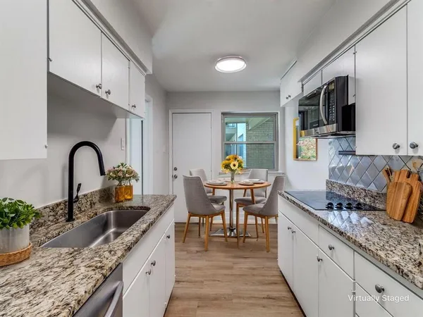 a kitchen with granite countertop lots of counter top space