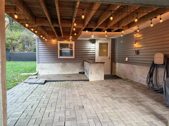 a view of a porch with wooden floor and roof