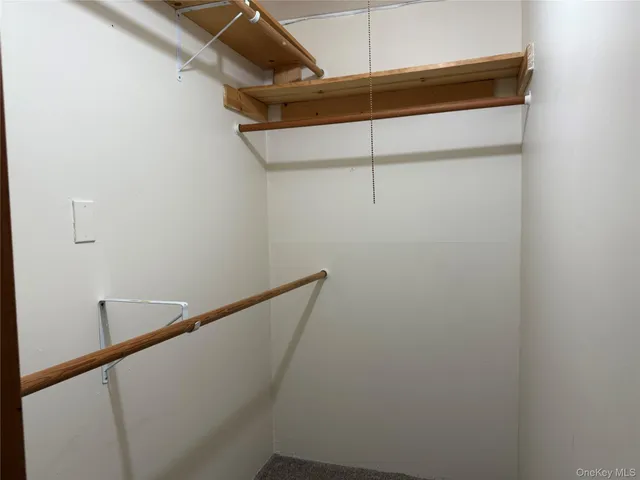 a view of a room with racks on the wall