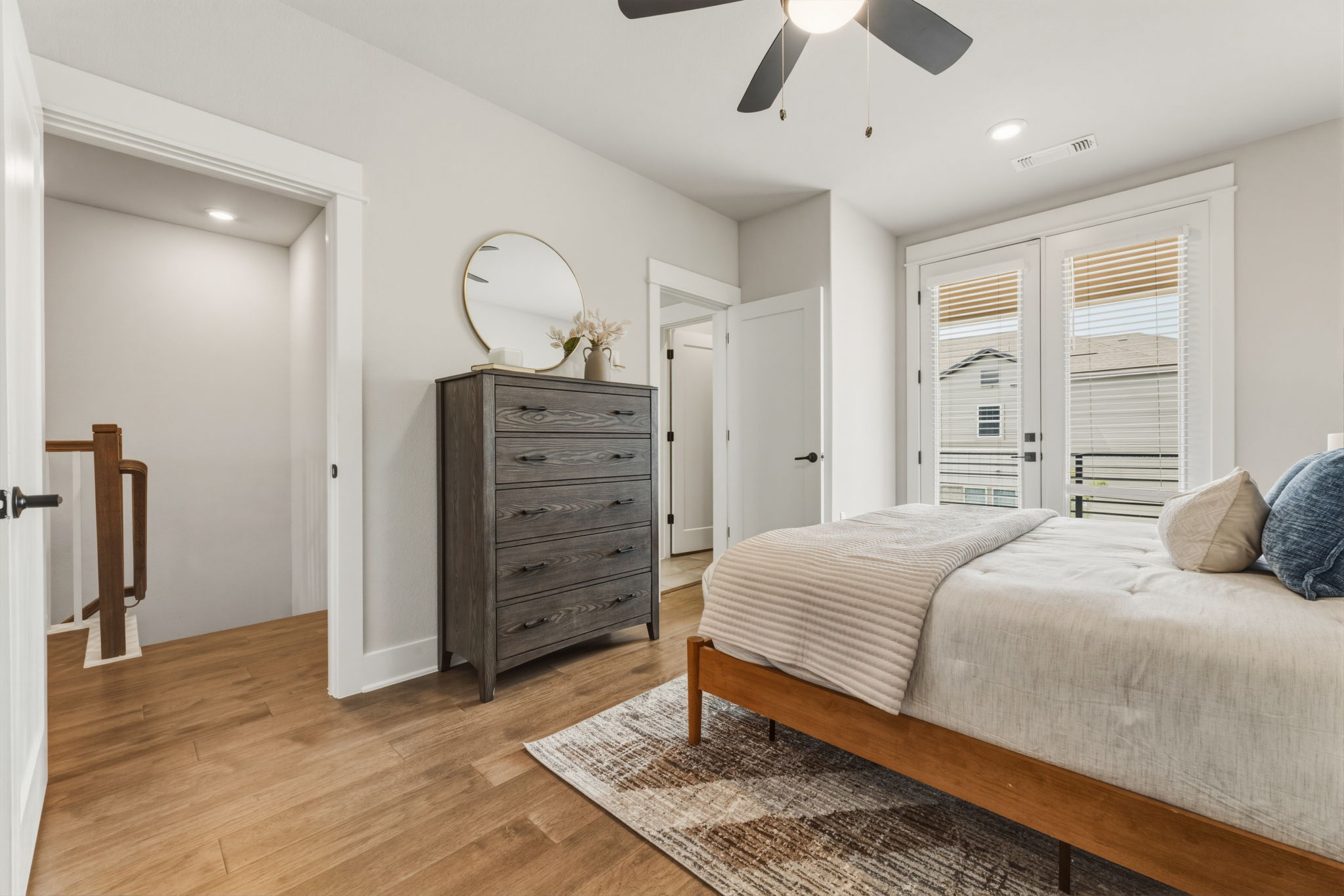 2929 Moreno Street Austin, TX 78723 - Photo 32 of 40 Bright room featuring wood-finish flooring, a ceiling fan, recessed lighting, and white French doors with integrated blinds