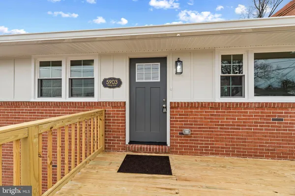 a view of a brick buildings with wooden door