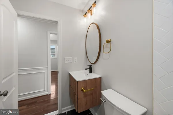 a bathroom with a sink a mirror and a shower