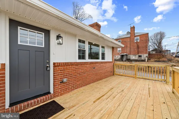 a view of a balcony with wooden floor