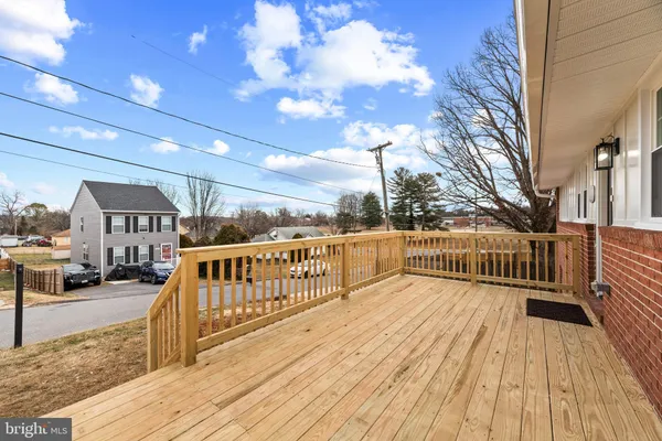 a view of balcony with deck and wooden floor
