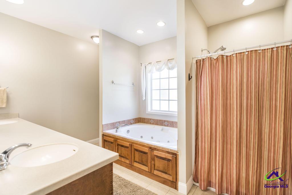 204 Smith Road Haddock, GA 31033 - Photo 21 of 51 a bathroom with a sink and a mirror