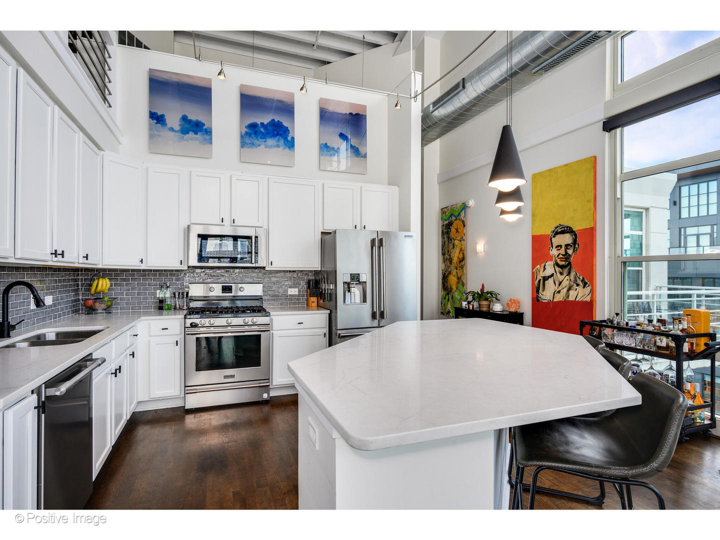 909 West Washington Boulevard, Unit 1012 Chicago, IL 60607 - Photo 11 of 30 a kitchen with stainless steel appliances a stove a sink dishwasher and cabinets