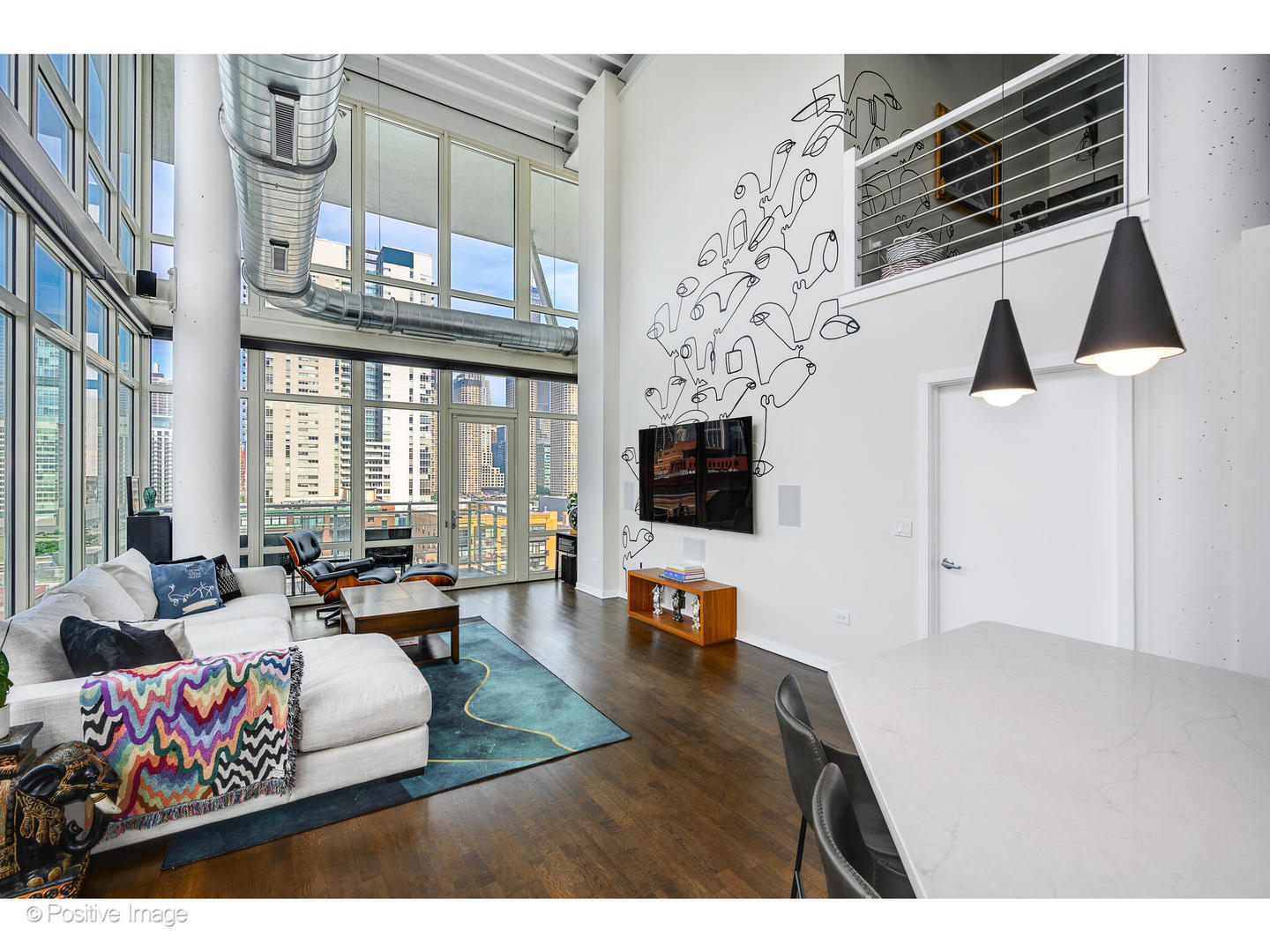 909 West Washington Boulevard, Unit 1012 Chicago, IL 60607 - Photo 13 of 30 a living room with furniture and a flat screen tv