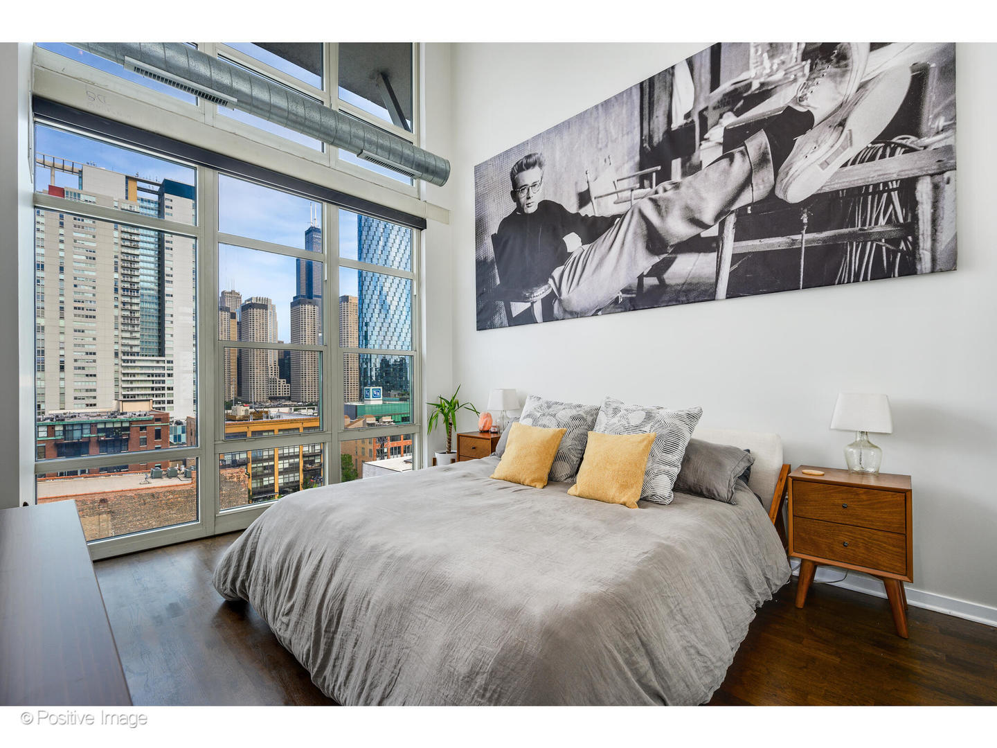 909 West Washington Boulevard, Unit 1012 Chicago, IL 60607 - Photo 15 of 30 a bedroom with a large bed and a window with outer view