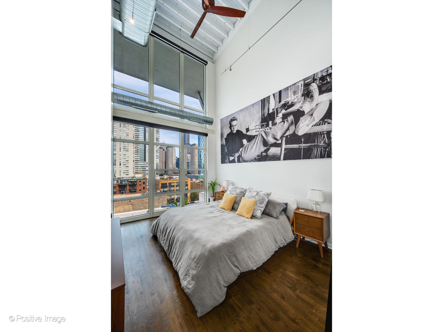 909 West Washington Boulevard, Unit 1012 Chicago, IL 60607 - Photo 16 of 30 a bedroom with a bed and window