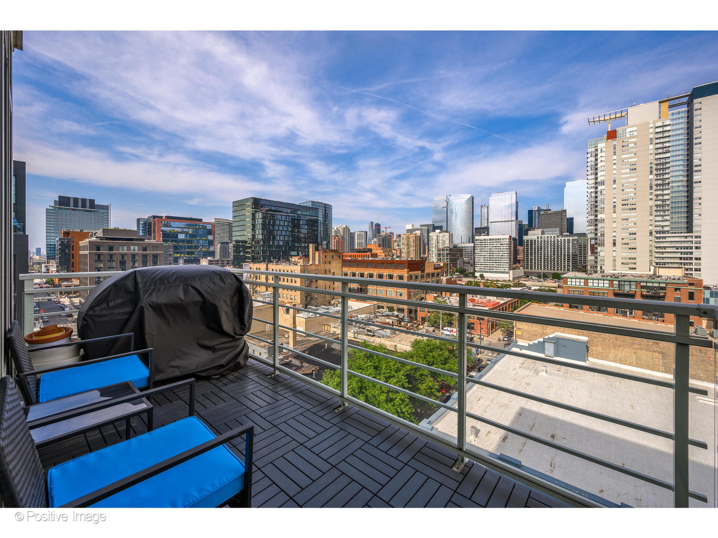 909 West Washington Boulevard, Unit 1012 Chicago, IL 60607 - Photo 22 of 30 a view of a terrace with wooden benches