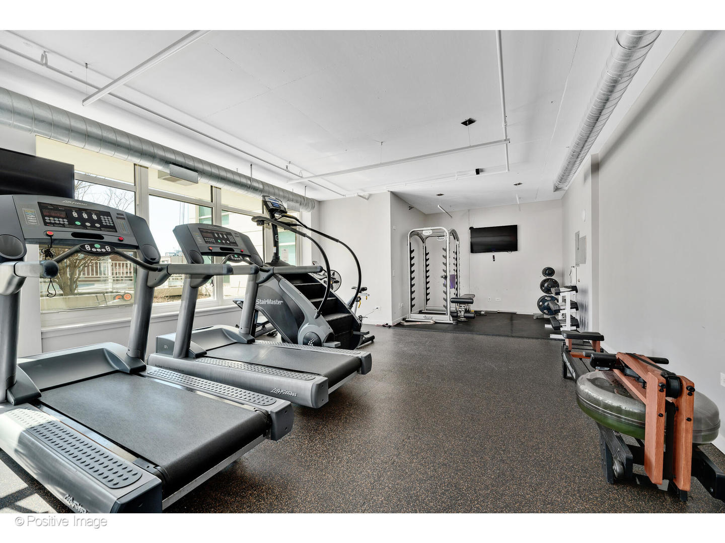 909 West Washington Boulevard, Unit 1012 Chicago, IL 60607 - Photo 27 of 30 a view of a room with gym equipment