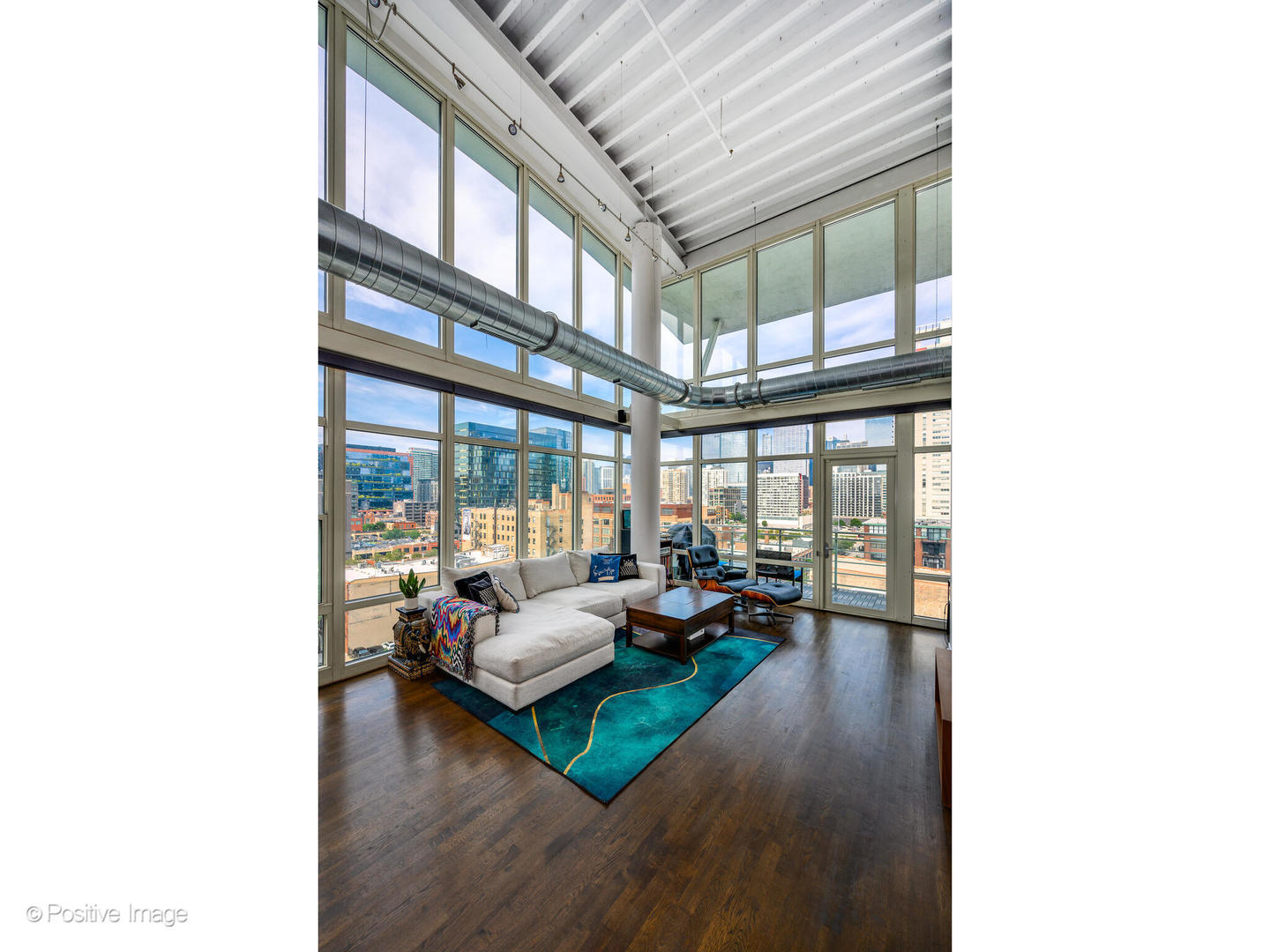 909 West Washington Boulevard, Unit 1012 Chicago, IL 60607 - Photo 4 of 30 a living room with furniture and a large window