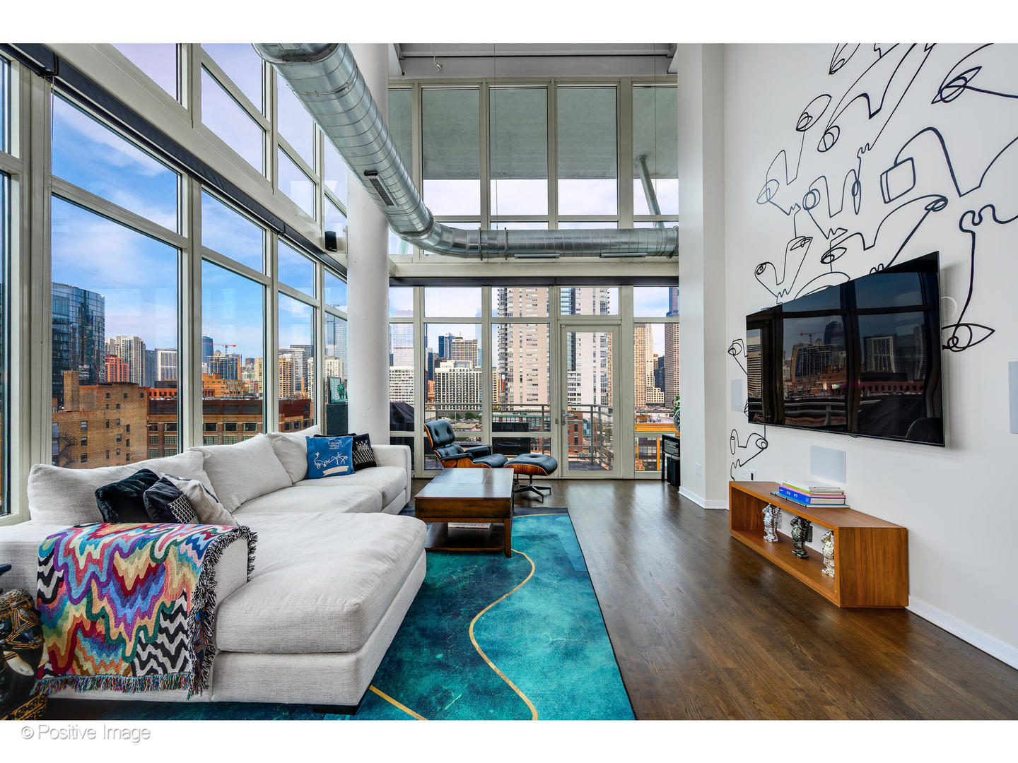 909 West Washington Boulevard, Unit 1012 Chicago, IL 60607 - Photo 5 of 30 a living room with fireplace furniture and a flat screen tv