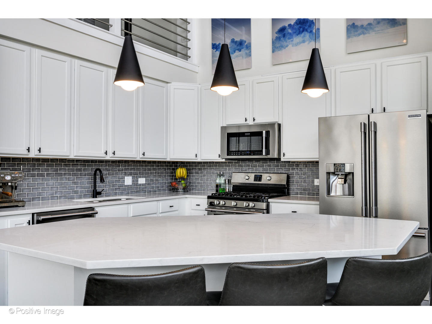 909 West Washington Boulevard, Unit 1012 Chicago, IL 60607 - Photo 9 of 30 a kitchen with stainless steel appliances a sink a stove and a refrigerator
