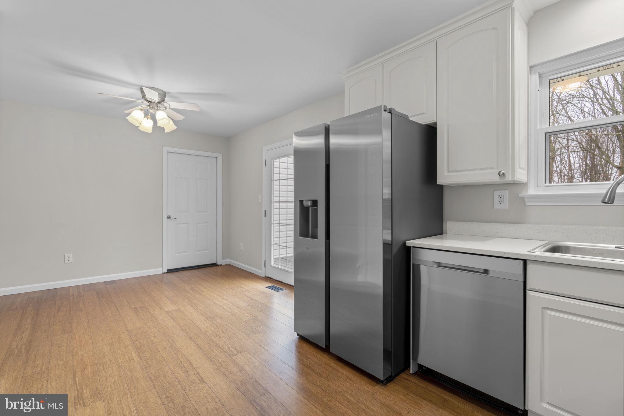 7818 Metacomet Road Hanover, MD 21076 - Photo 15 of 52 a kitchen with a refrigerator sink and cabinets