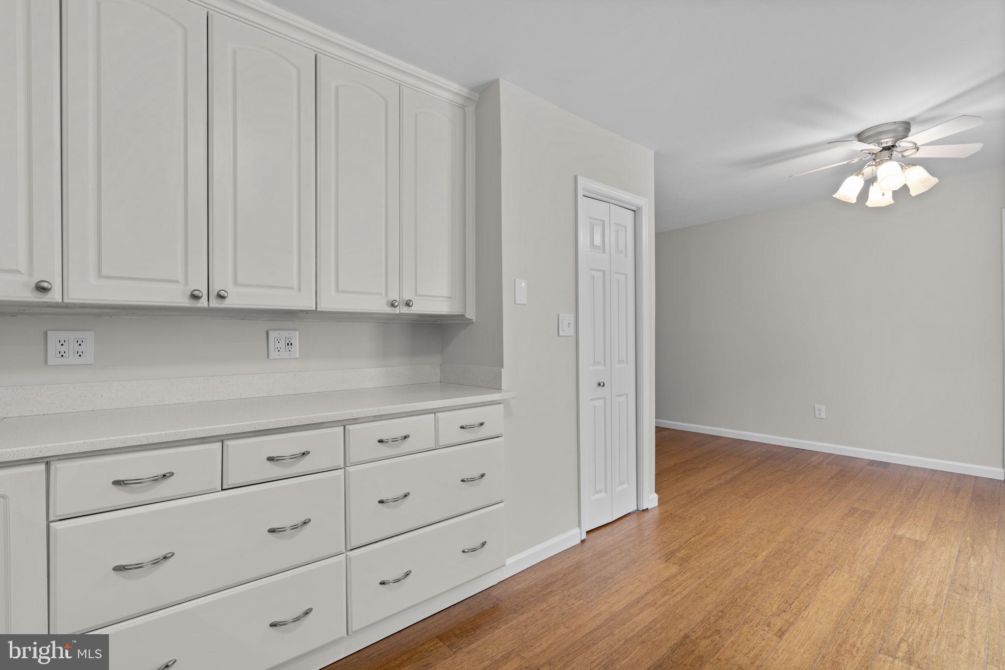 7818 Metacomet Road Hanover, MD 21076 - Photo 16 of 52 a view of cabinets and wooden floor