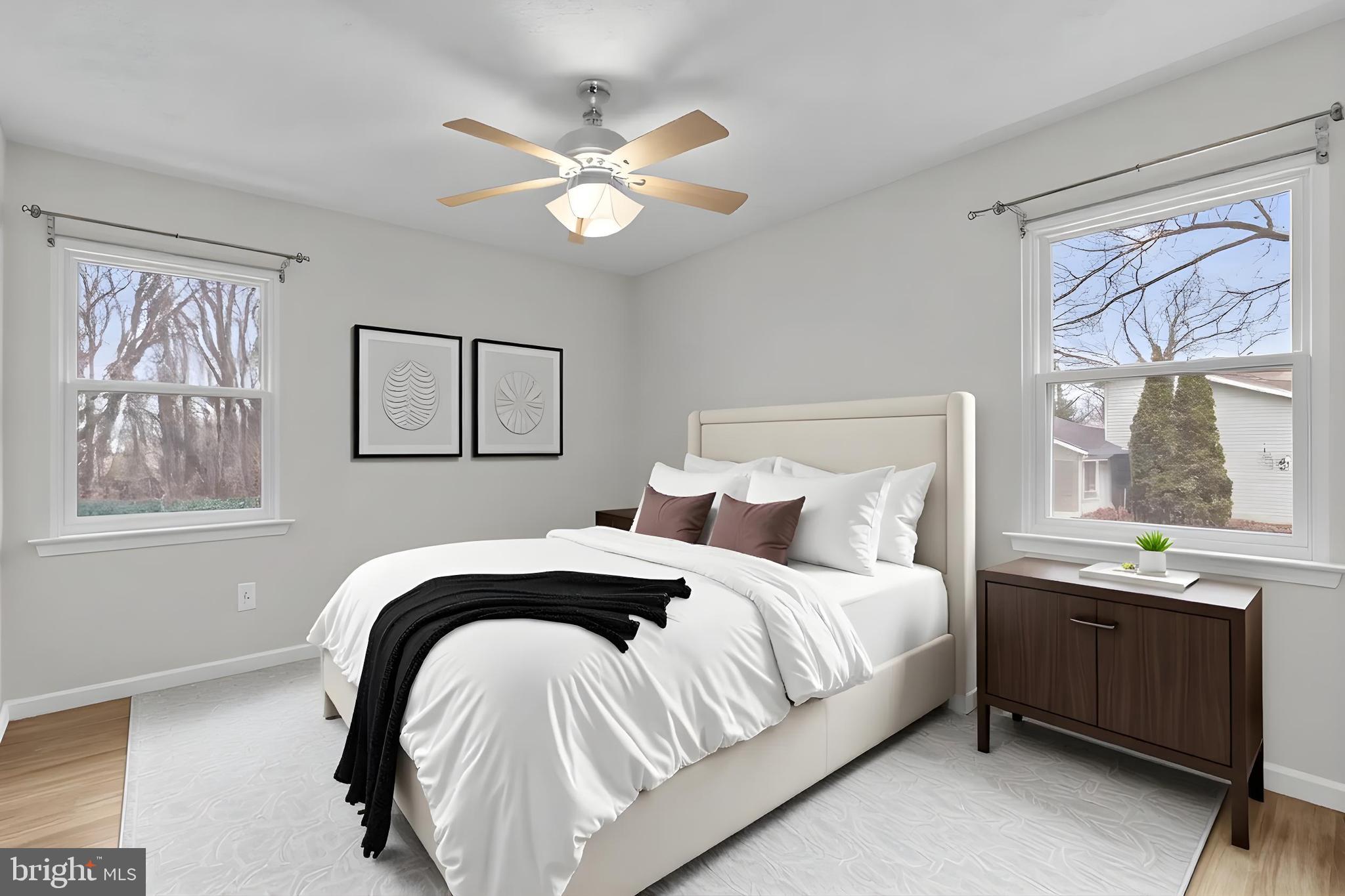 7818 Metacomet Road Hanover, MD 21076 - Photo 17 of 52 a bedroom with a bed and a chandelier