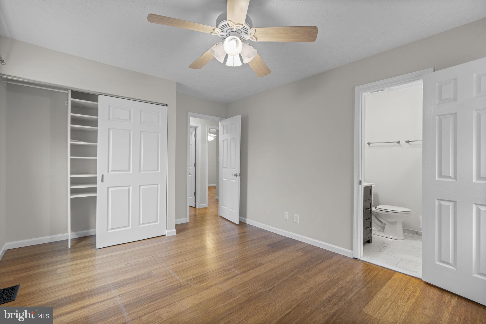 7818 Metacomet Road Hanover, MD 21076 - Photo 20 of 52 a view of a room with wooden floor and ceiling fan