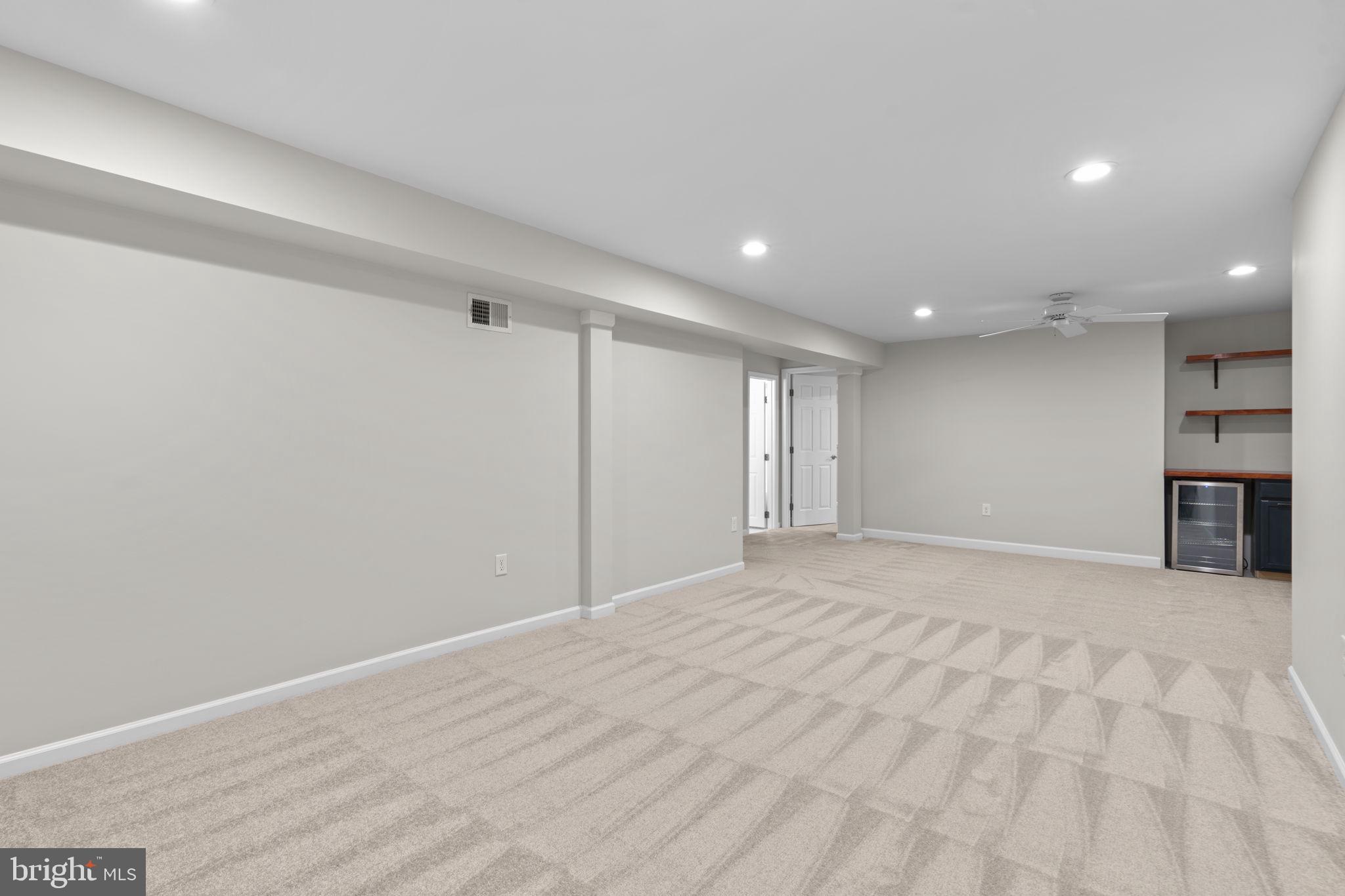 7818 Metacomet Road Hanover, MD 21076 - Photo 34 of 52 a view of an empty room with a kitchen