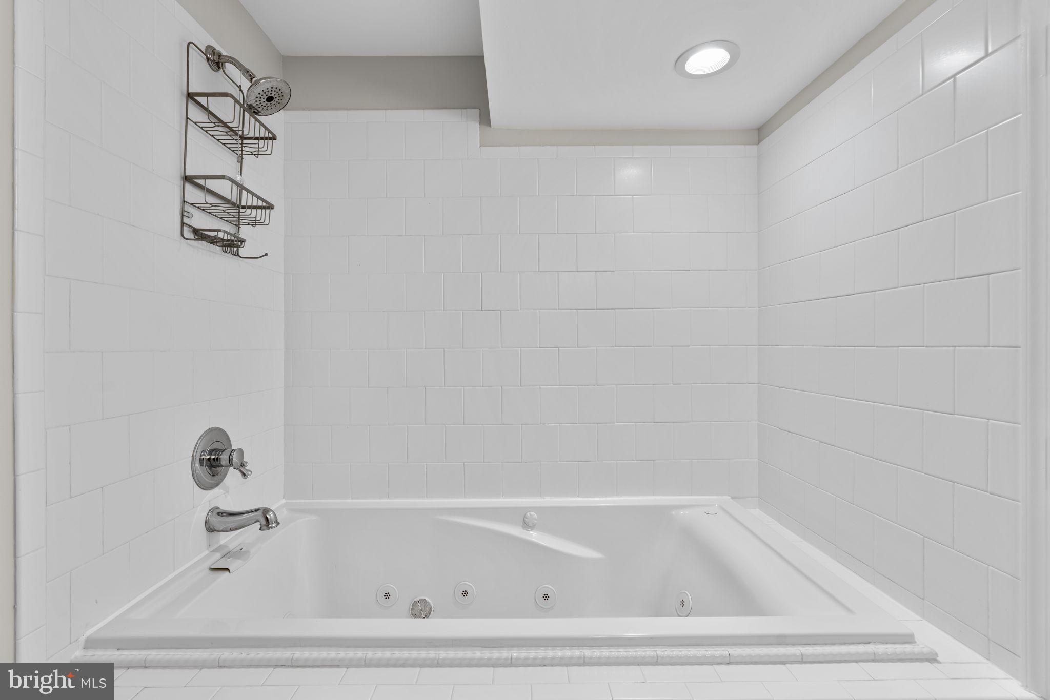 7818 Metacomet Road Hanover, MD 21076 - Photo 40 of 52 a bathroom with a bathtub