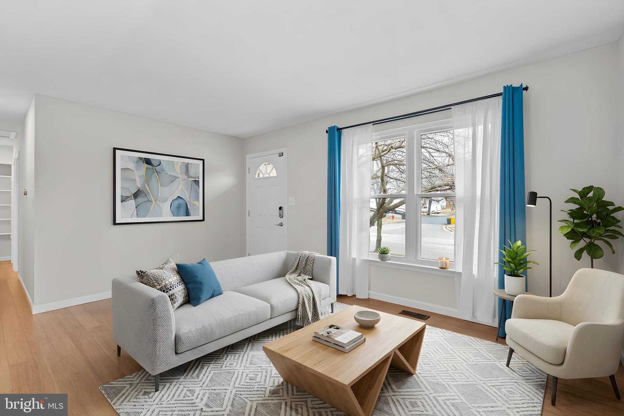 7818 Metacomet Road Hanover, MD 21076 - Photo 4 of 52 a living room with furniture and a large window