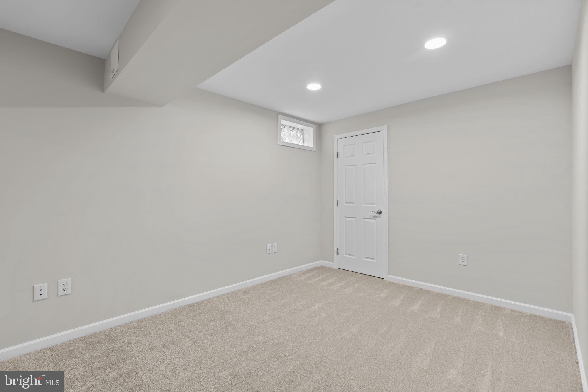 7818 Metacomet Road Hanover, MD 21076 - Photo 42 of 52 Basement bedroom with private exterior entrance