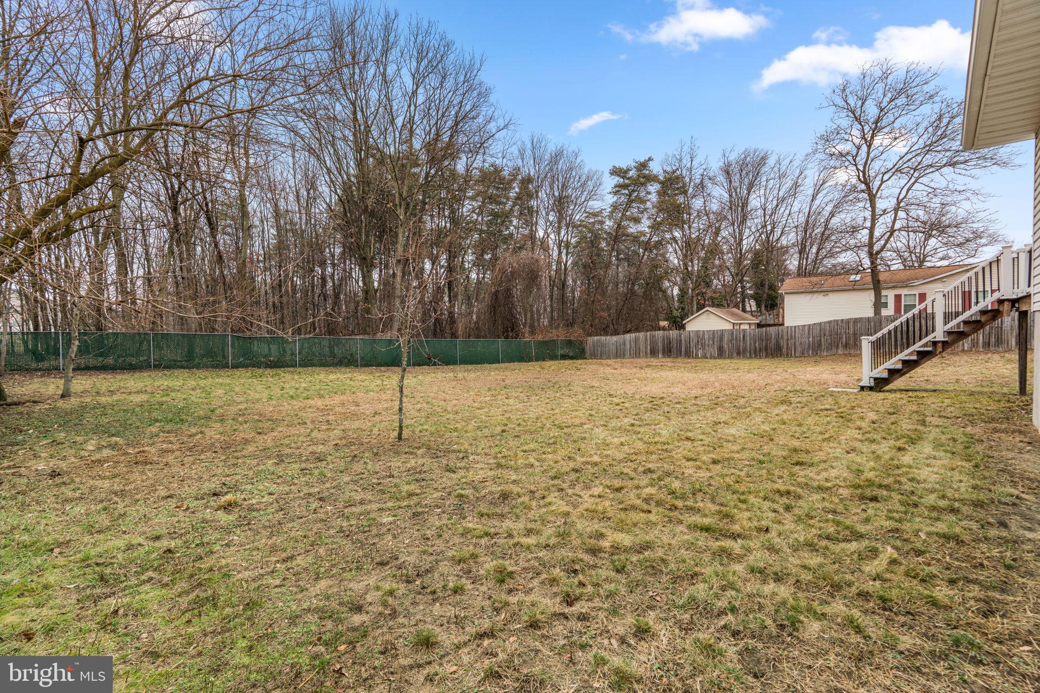 7818 Metacomet Road Hanover, MD 21076 - Photo 52 of 52 a backyard of a house with lots of green space
