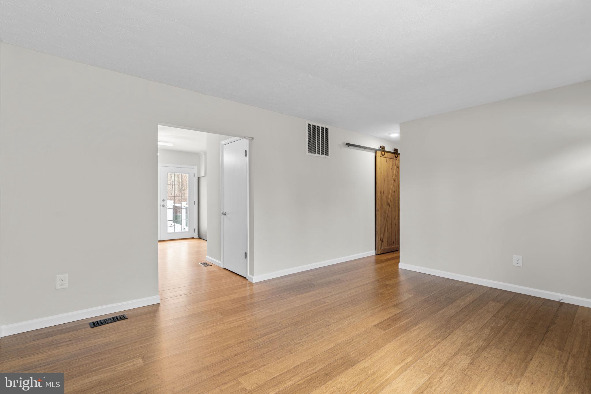 7818 Metacomet Road Hanover, MD 21076 - Photo 7 of 52 wooden floor in an empty room