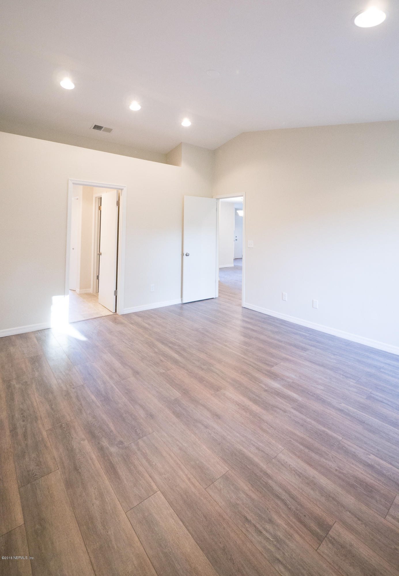 944 Aries Road West Jacksonville, FL 32216 - Photo 21 of 47 Master Bedroom with Vaulted Ceilings
