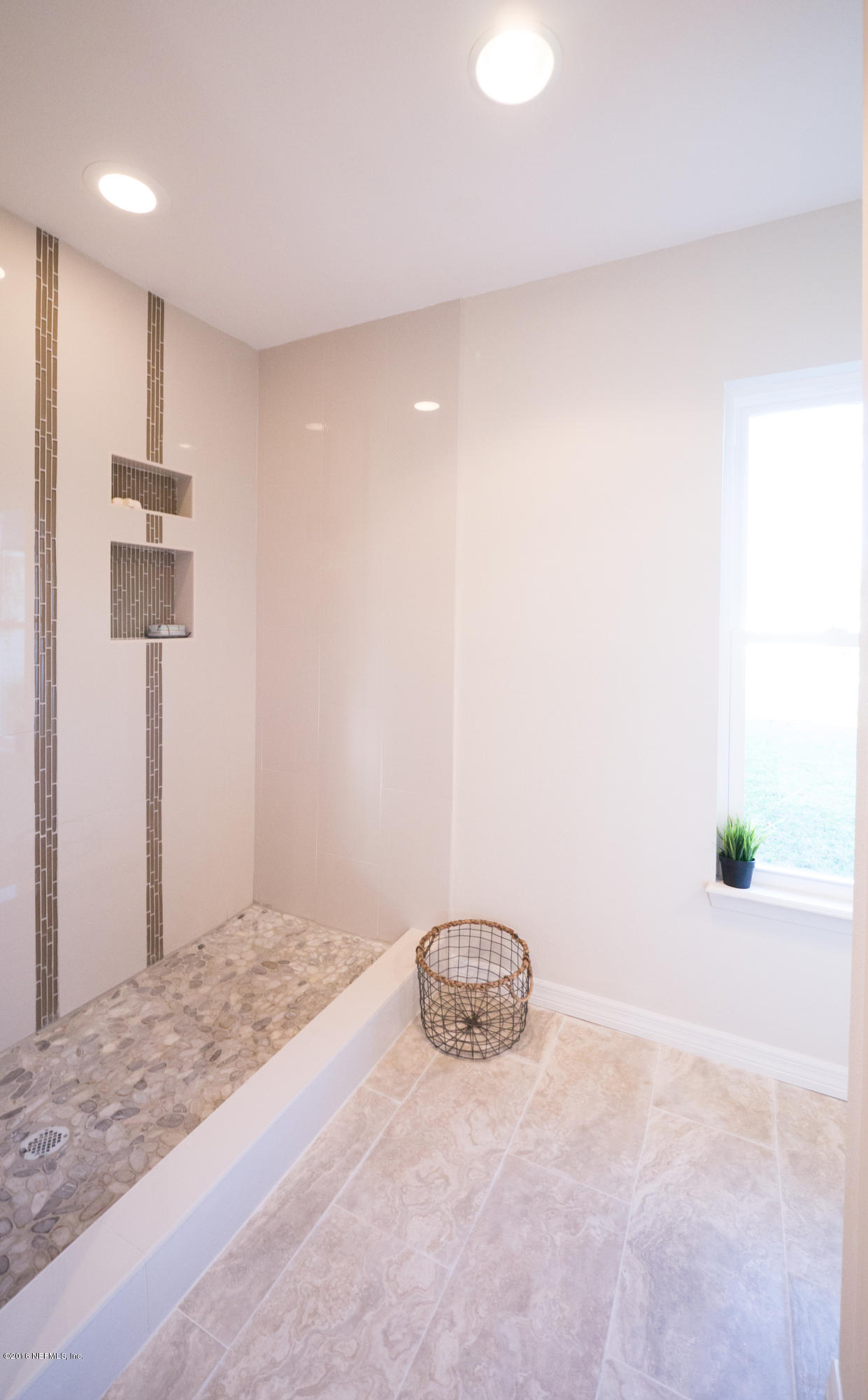 944 Aries Road West Jacksonville, FL 32216 - Photo 28 of 47 12 x 24 Tiles with Accent Glass Tile