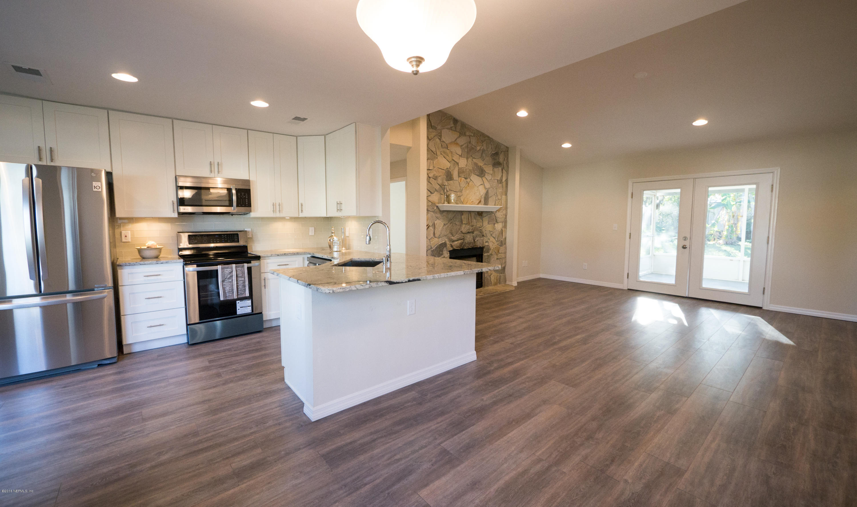 944 Aries Road West Jacksonville, FL 32216 - Photo 3 of 47 Dining to Kitchen & Living Room View