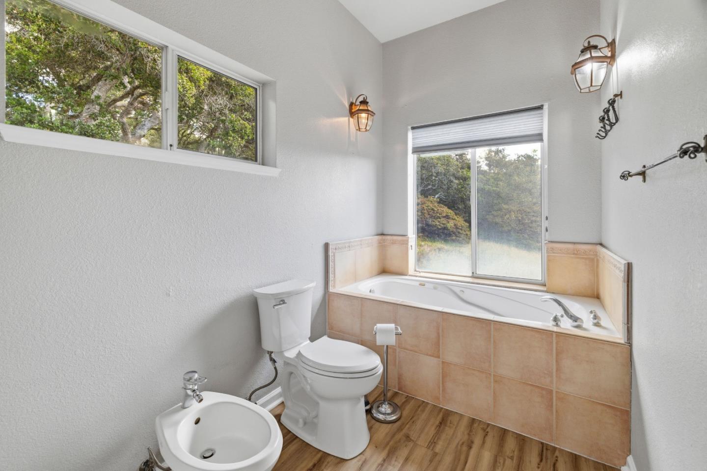 19269 Mallory Canyon Road, Unit D Salinas, CA 93907 - Photo 31 of 77 a bathroom with a toilet a sink and a shower