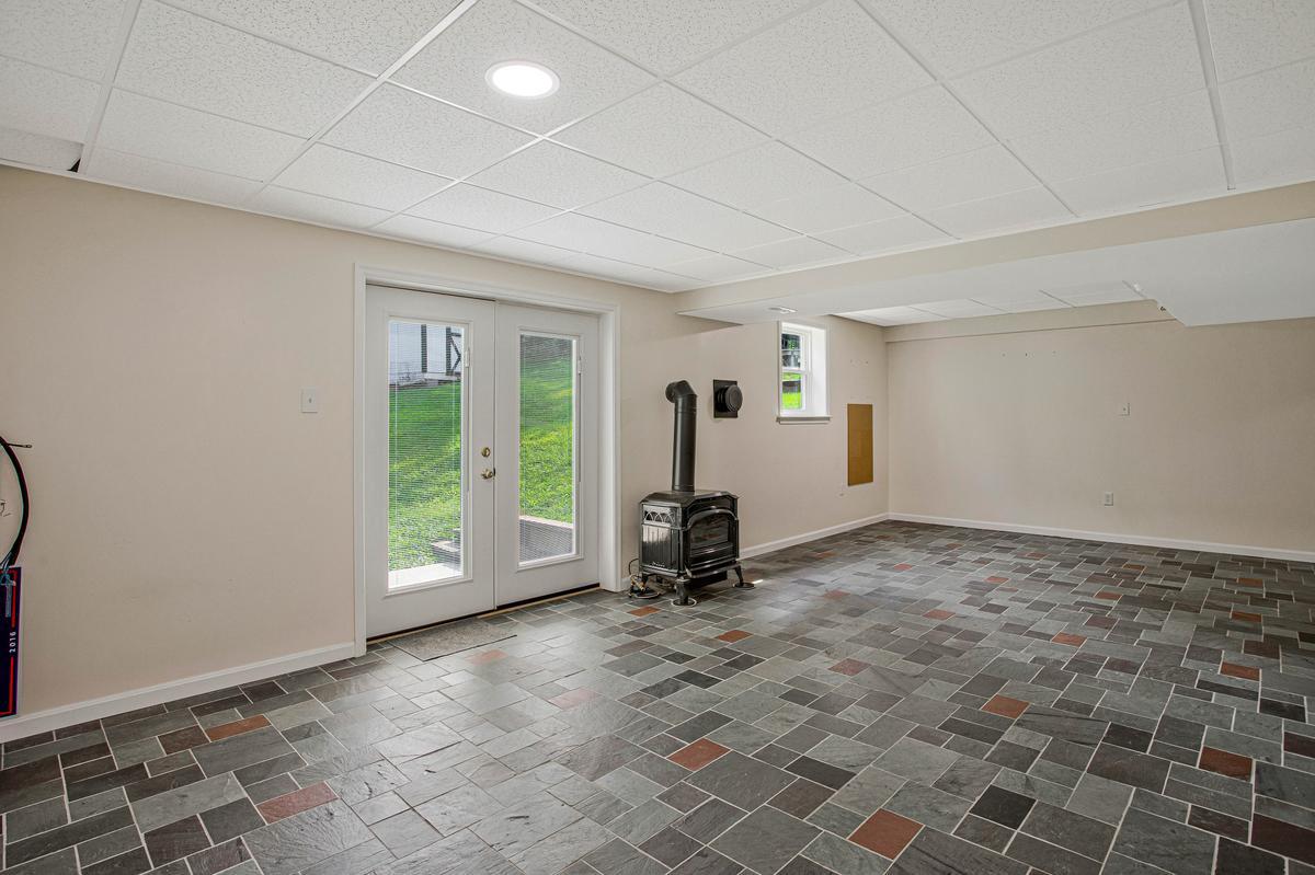 8070 Nursery Road Lusby, MD 20657 - Photo 32 of 47 Spacious walkout basement with natural light.