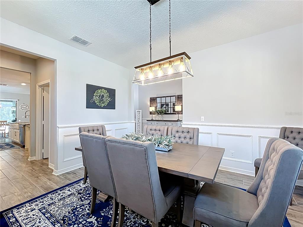 2676 Estuary Loop Oviedo, FL 32765 - Photo 11 of 92 a view of a dining room with furniture