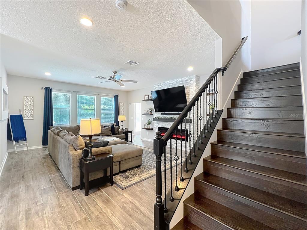 2676 Estuary Loop Oviedo, FL 32765 - Photo 28 of 92 a living room with furniture and a flat screen tv